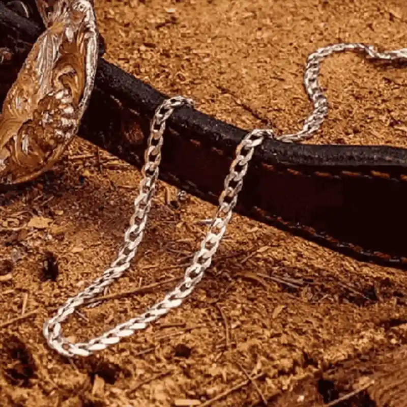 Silver Chain for Women on a log with a cuban link type